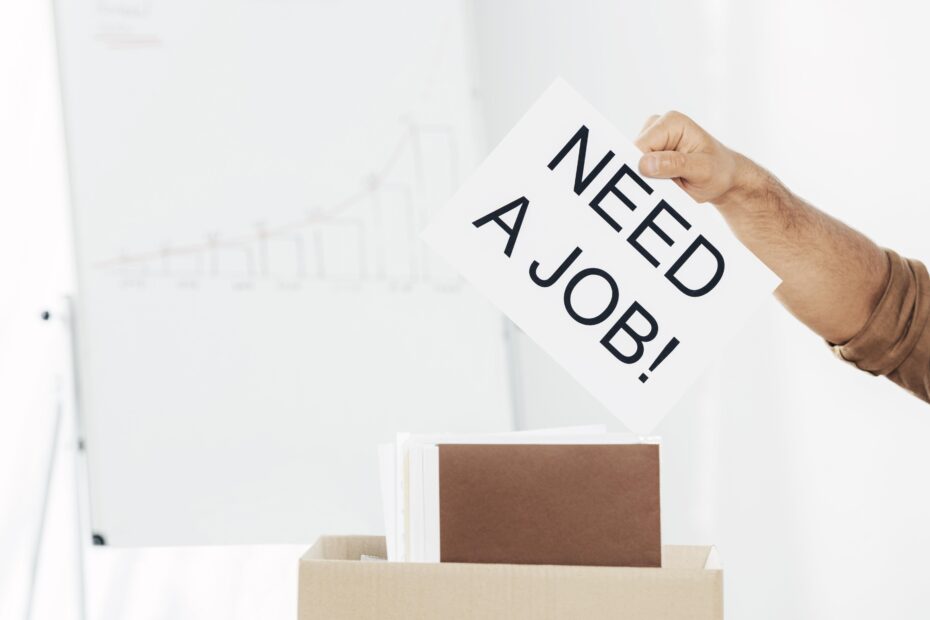 close-up-hand-holding-need-job-sign